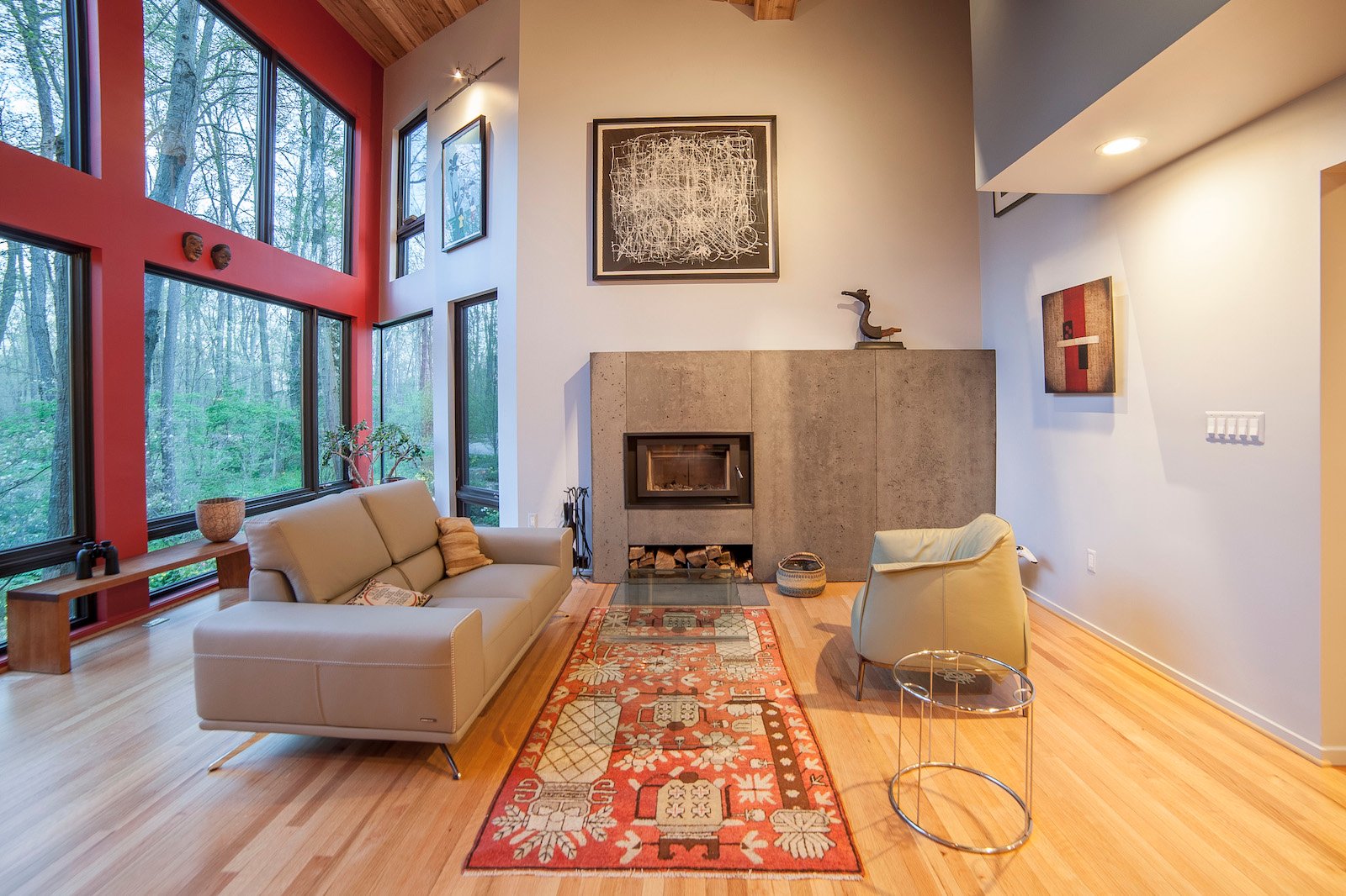 Interior addition with custom windows and custom concrete fireplace surround