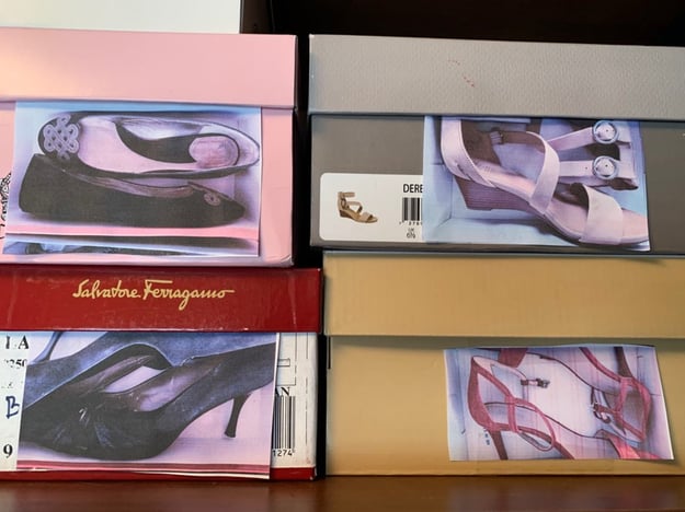 Shoe boxes with photos of the shoes on the outside