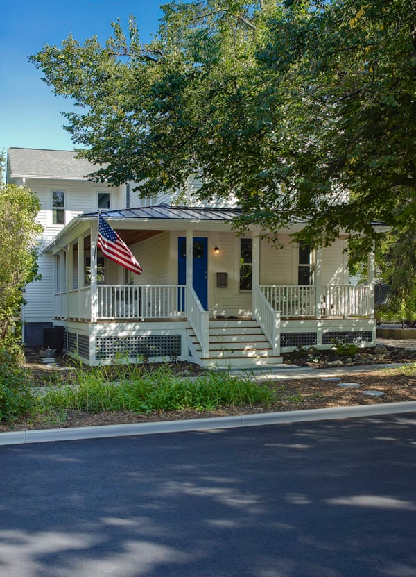 american flag front of house