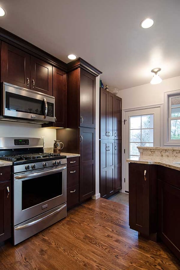 kitchen with dark wood cabinets and stainless steel appliances